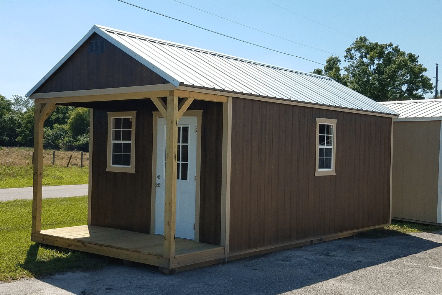 brown cabin shed with porch for sale in cape coral fl