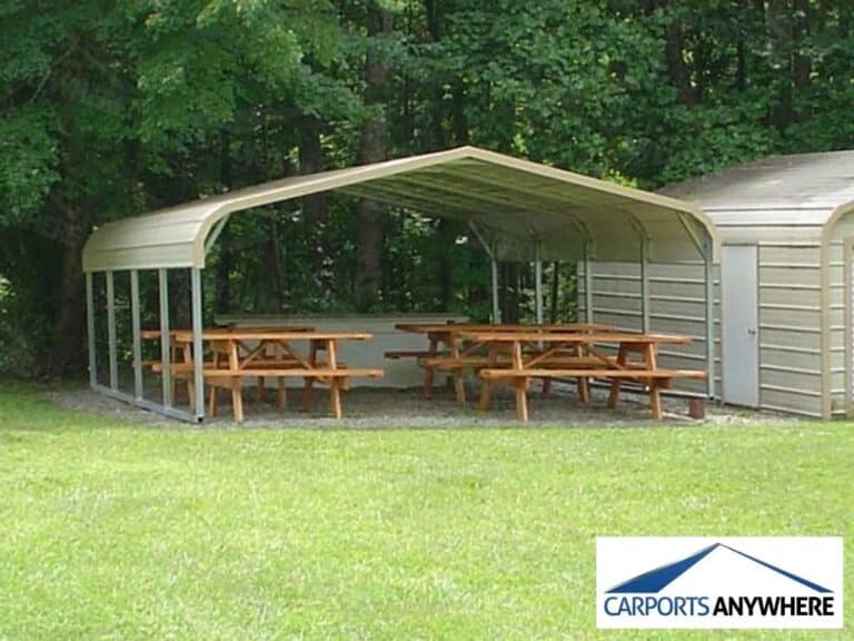 a metal carport with benches underneath