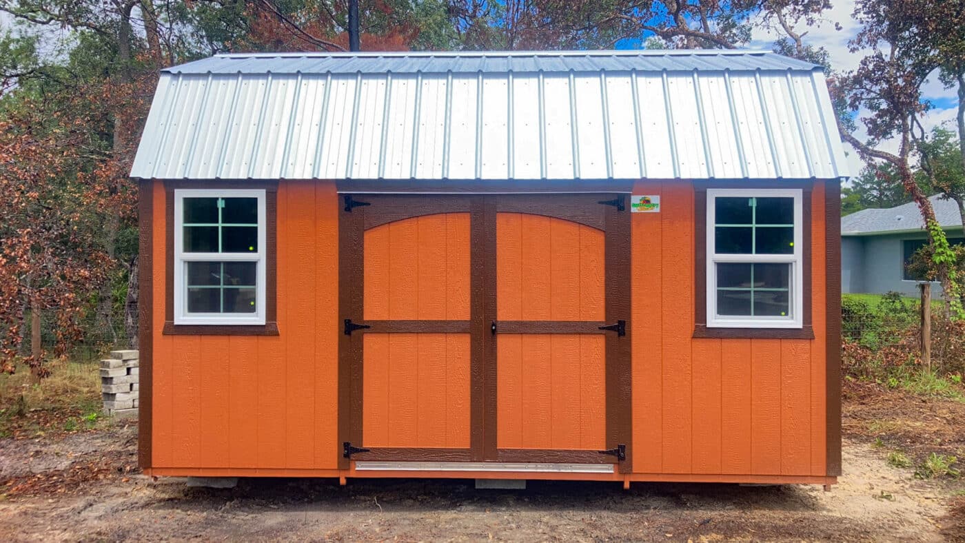 a reddish orange shed with a metal roof in florida