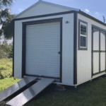 white and black garage shed with double doors and windows in haines city fl