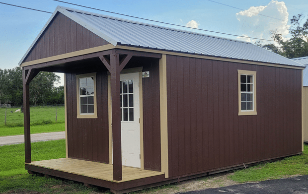 lofted cabin shed with a porch