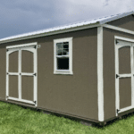 beige and white storage shed with double doors and windows in wauchula fl