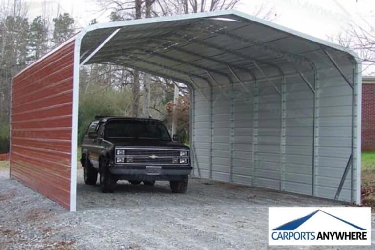 a red metal carport with a black car parked underneath it