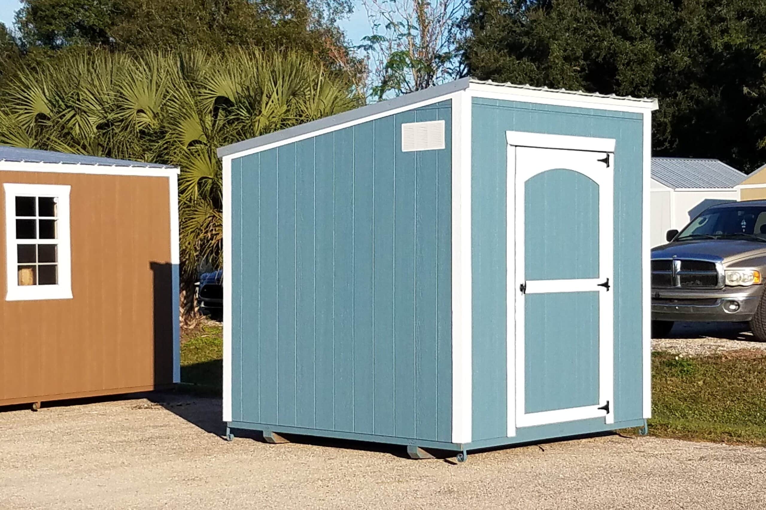 blue and white trimmed studio sheds in lehigh acres fl